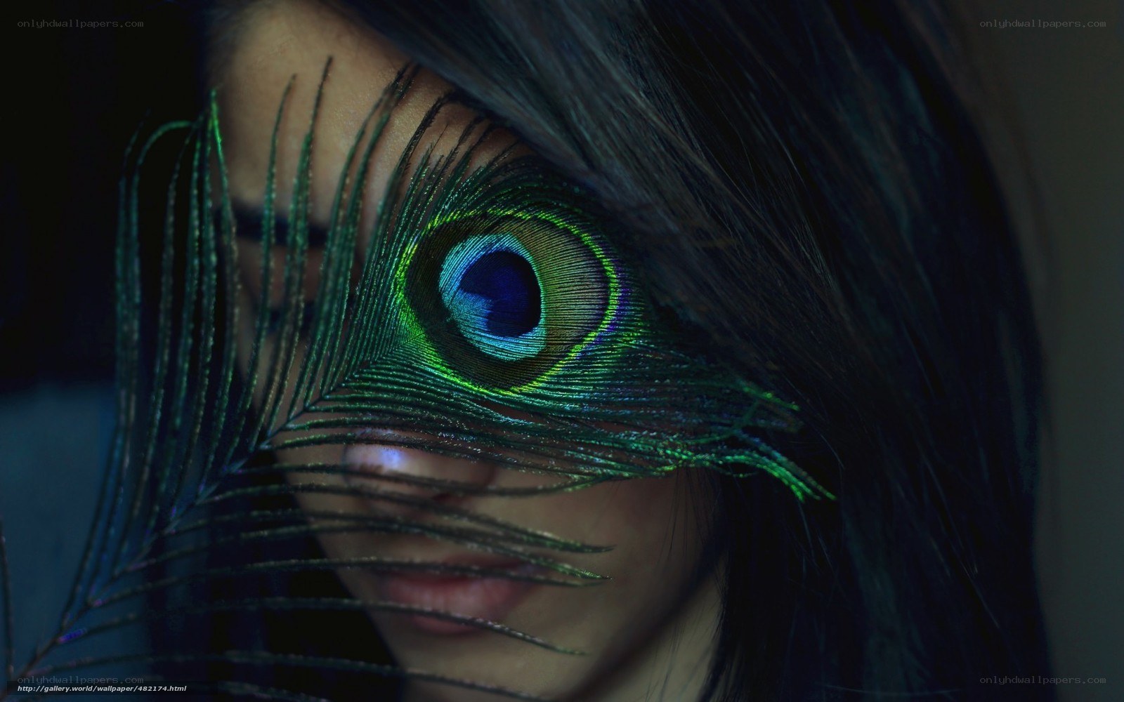 woman with peacock feather