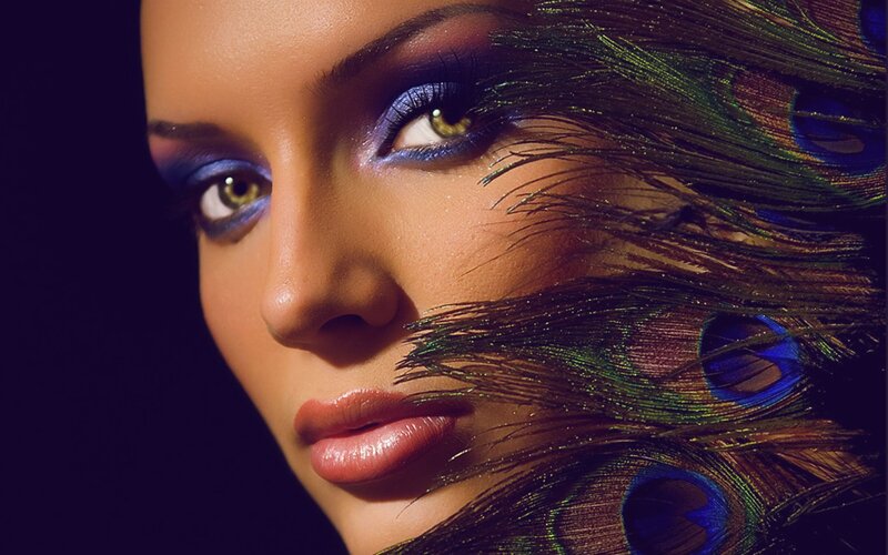 woman with peacock feathers