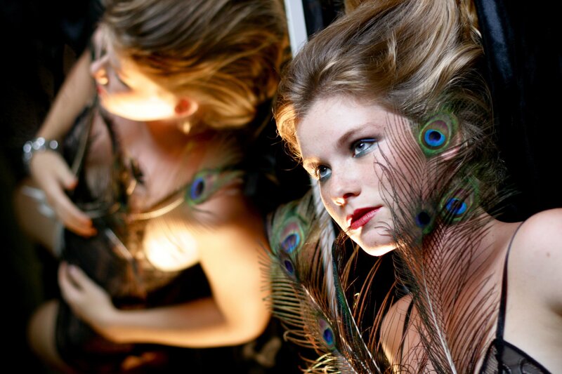 woman with peacock feathers