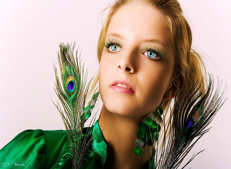 woman with peacock feathers