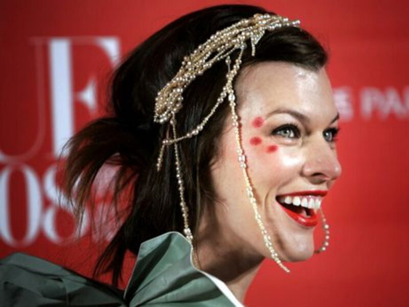 woman with pearl headpiece smiling
