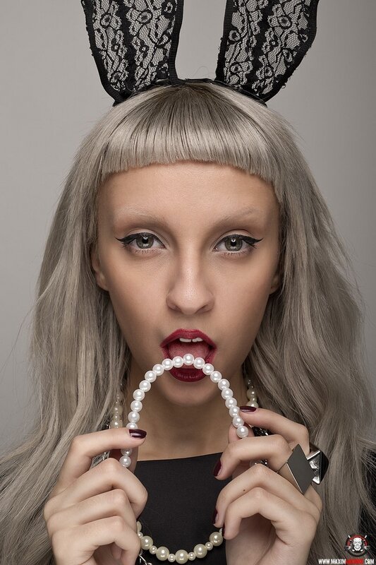 woman with pearls and bunny ears