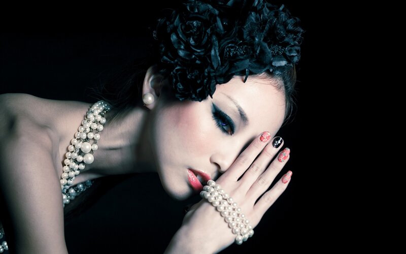 woman with pearls and flowers