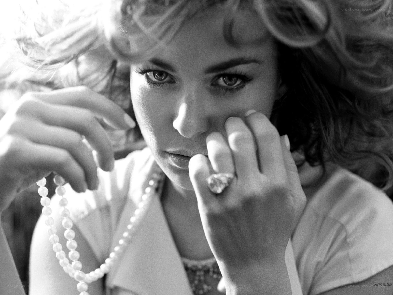 woman with pearls and ring