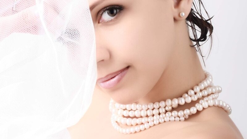 woman with pearls and veil