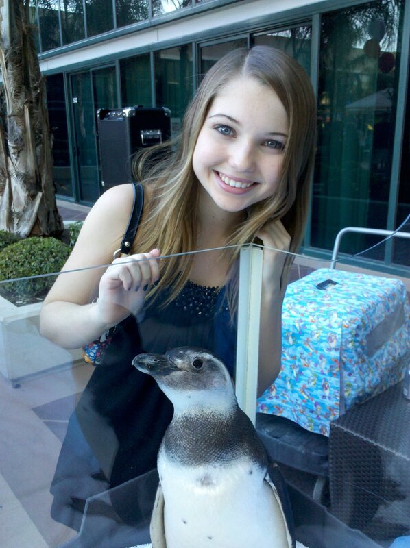 Woman with penguin at zoo