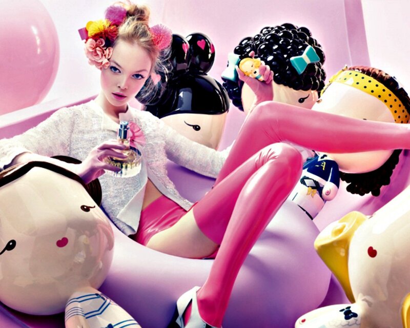 woman with perfume and dolls