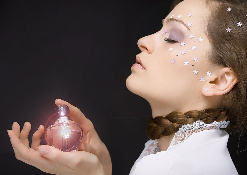 woman with perfume bottle