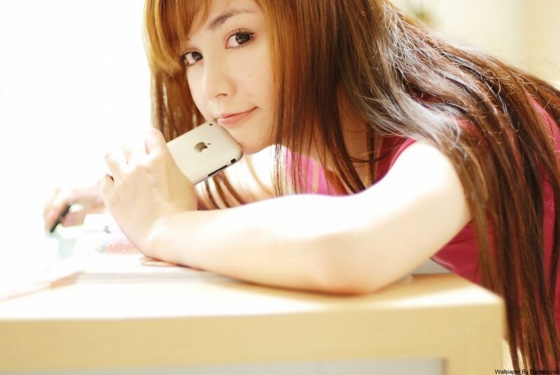 woman with phone at desk