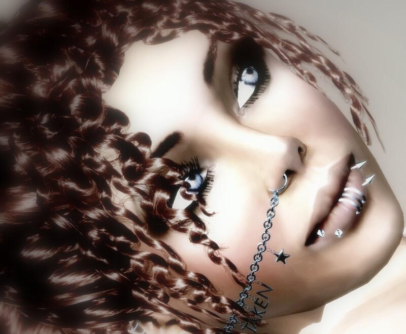 woman with piercings and curly hair
