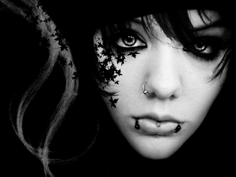woman with piercings and leaf art