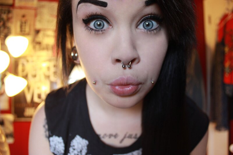 woman with piercings and tattoos