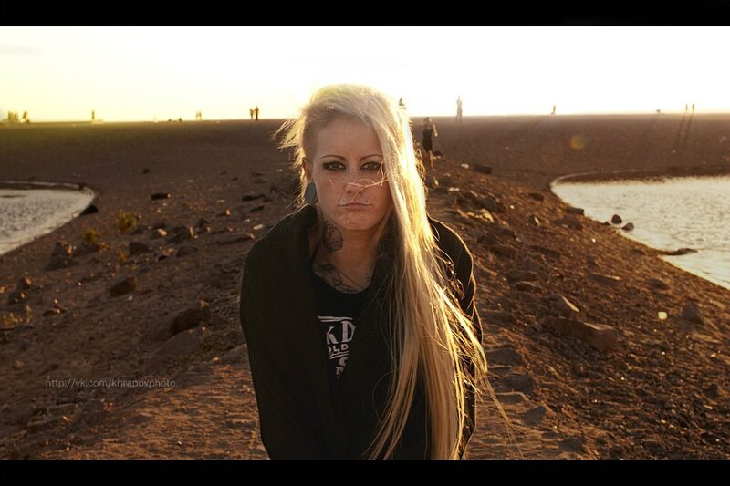 woman with piercings at sunset