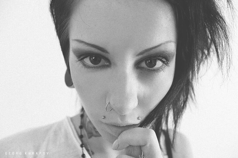 Woman with Piercings — Black, Dramatic, Photograph