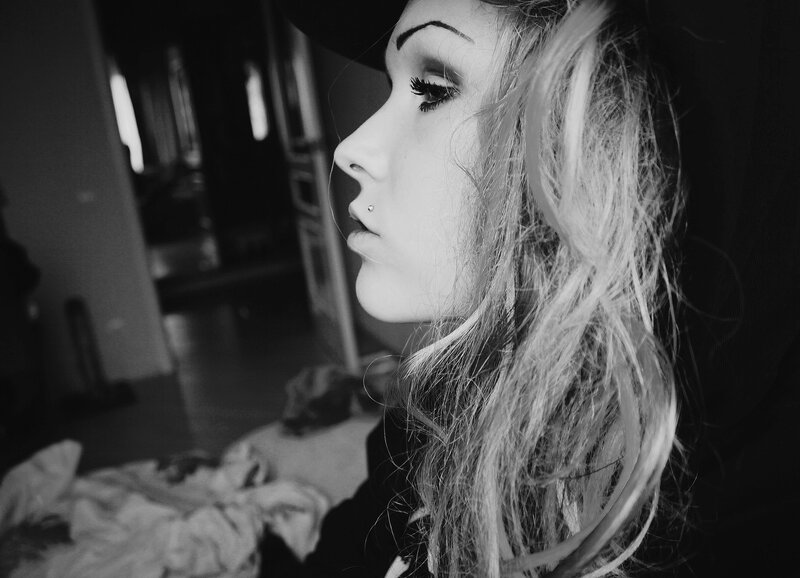 woman with piercings in profile