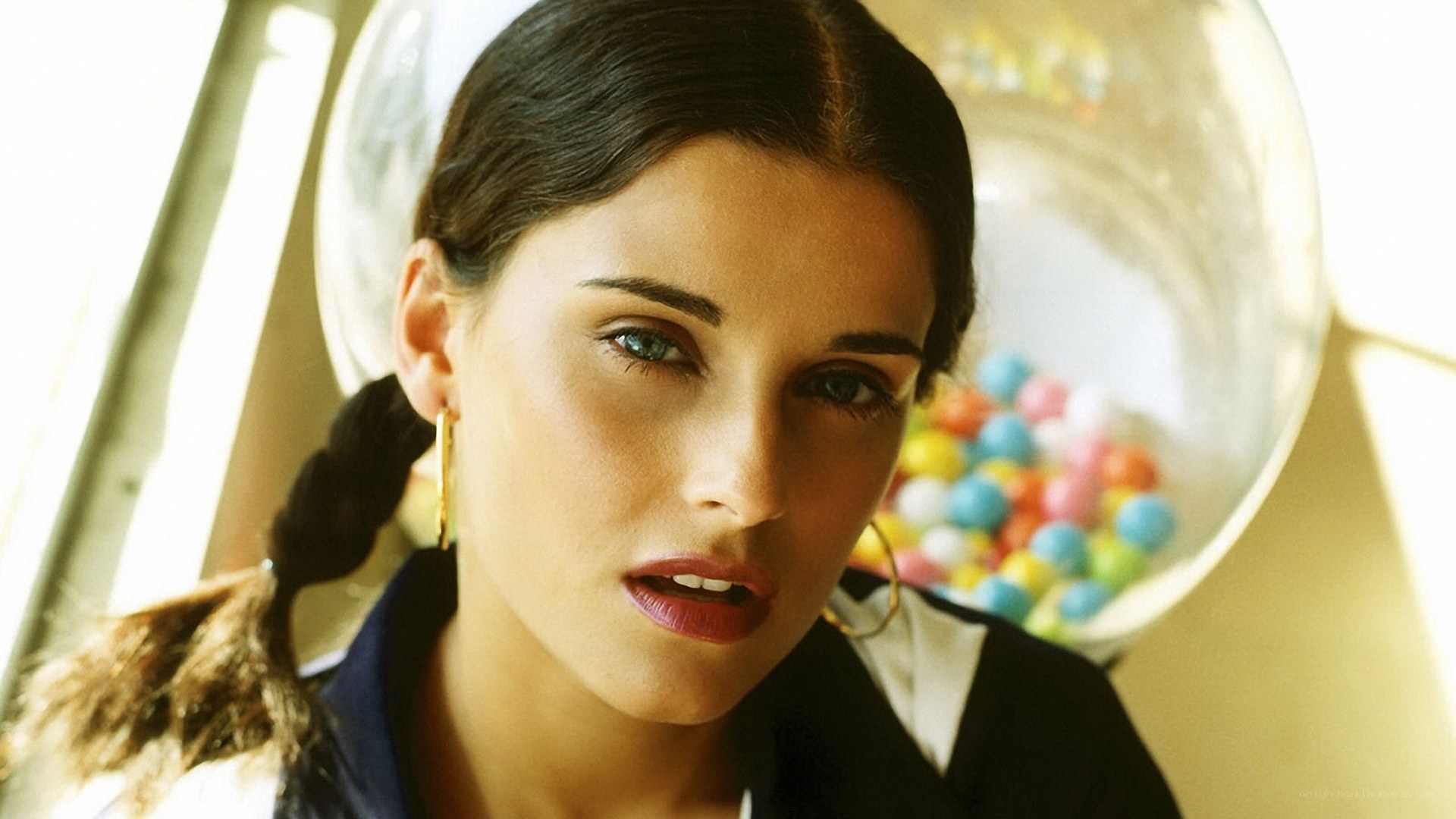 woman with pigtails and candy machine