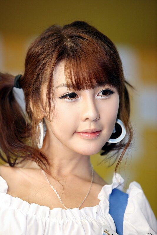 woman with pigtails and earrings