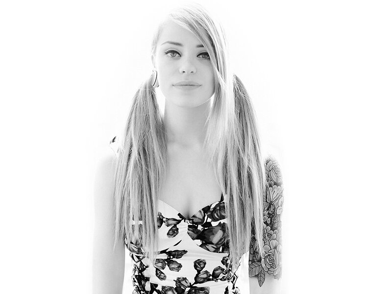 woman with pigtails and tattoo