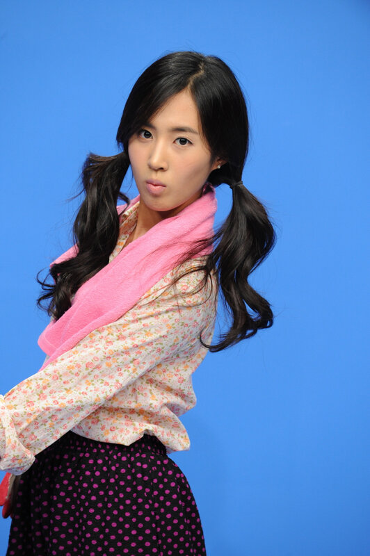 woman with pigtails in floral shirt