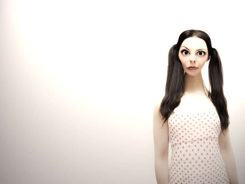 woman with pigtails in polka dot dress