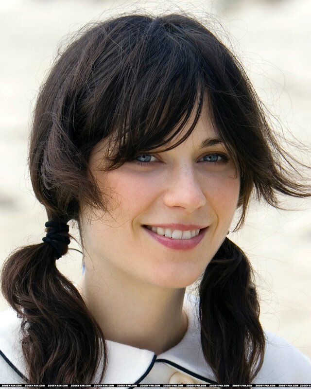 woman with pigtails smiling