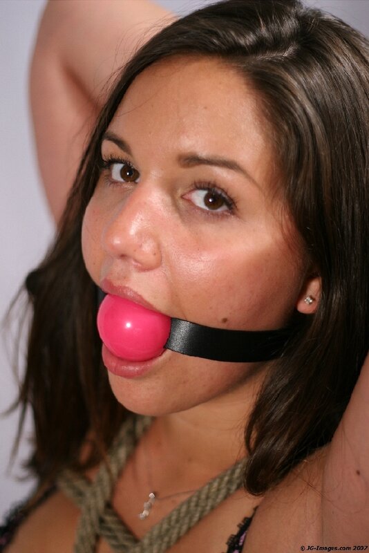 woman with pink ball gag