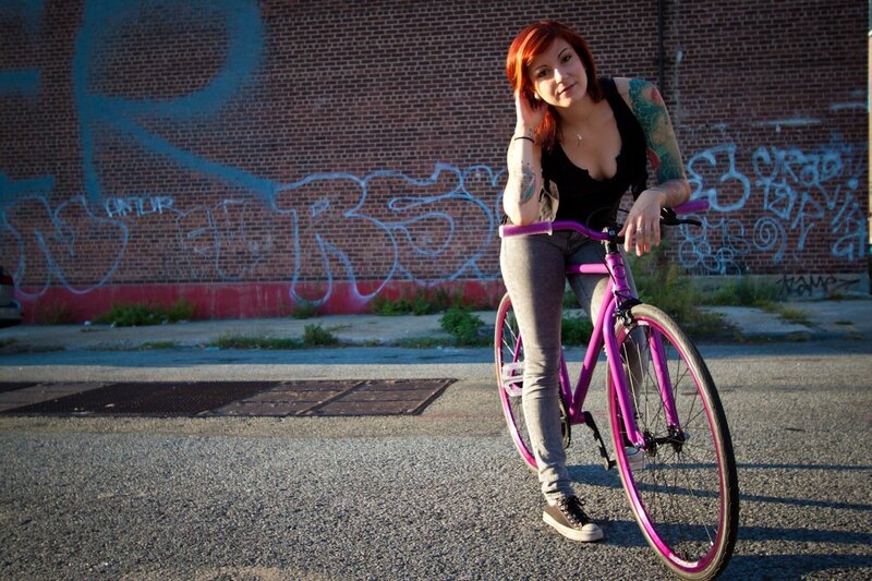 Woman with pink bicycle
