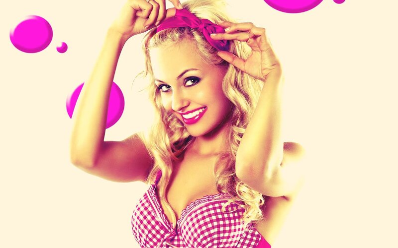 woman with pink bow smiling