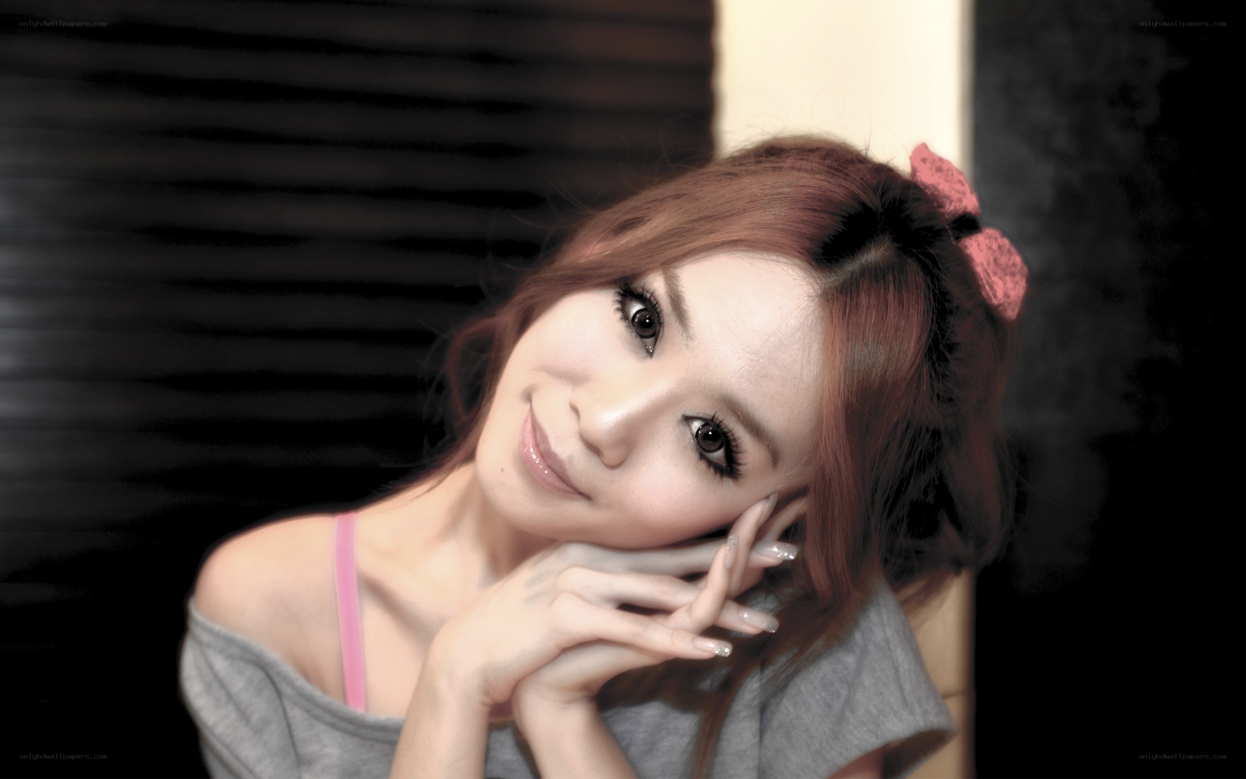 woman with pink bow smiling