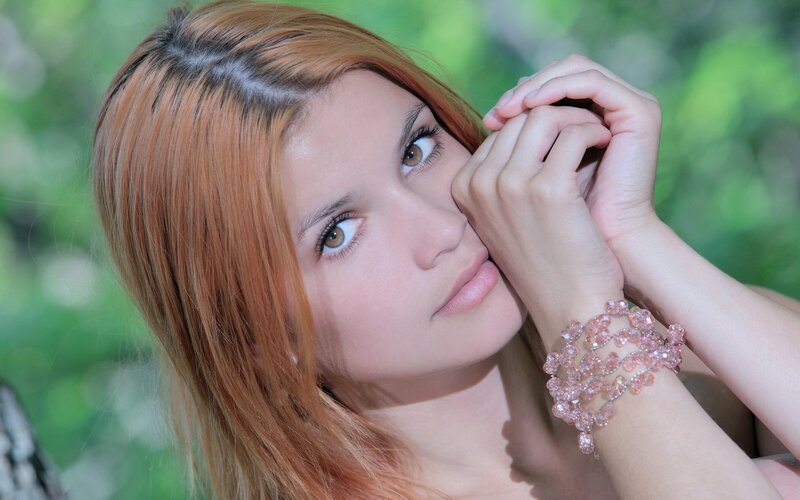 woman with pink bracelet