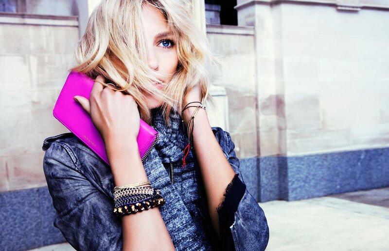 woman with pink clutch