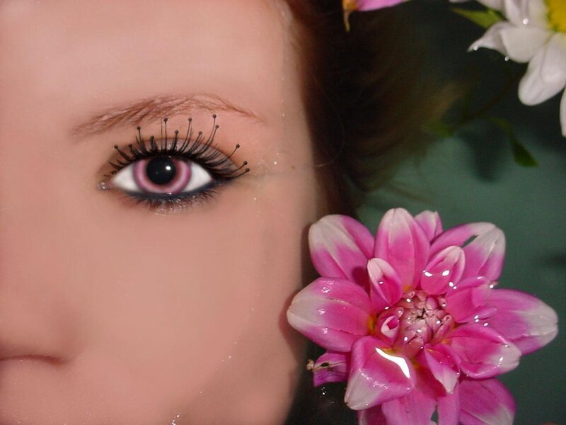 woman with pink contact lens