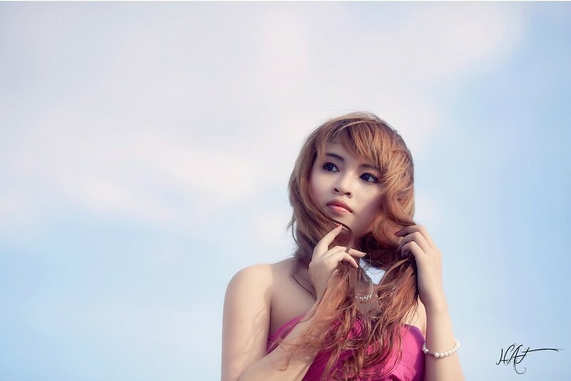 woman with pink dress against sky