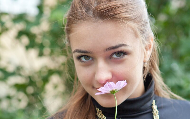 woman with pink flower