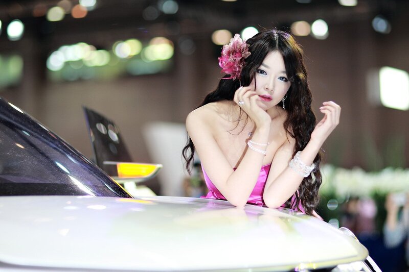 Woman with Pink Flower — Calm, Photograph, Car