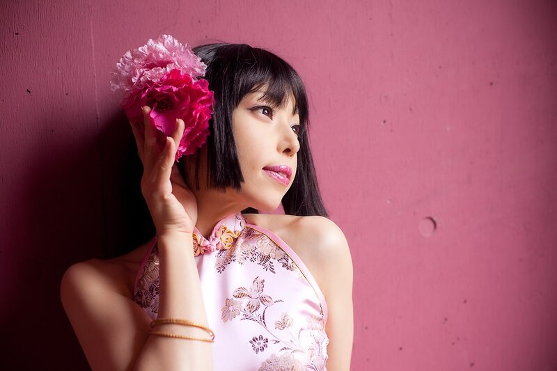 woman with pink flower in hair