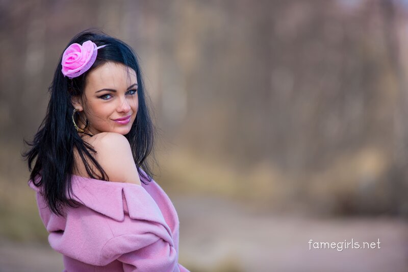 woman with pink flower in hair