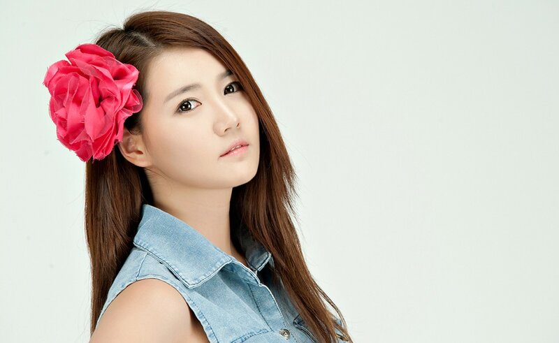 woman with pink flower in hair