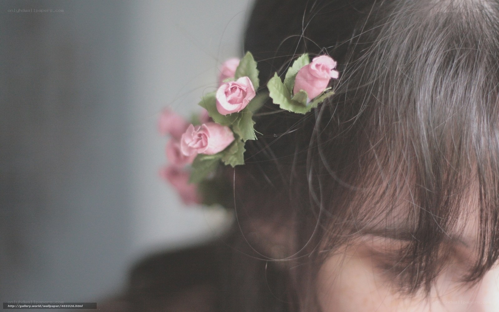woman with pink flowers in hair