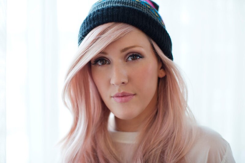 woman with pink hair and beanie