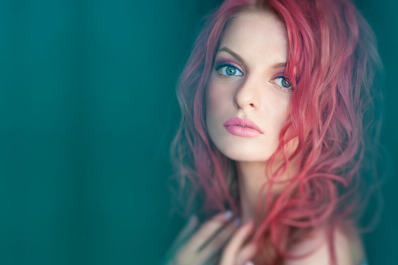 woman with pink hair and blue eyes