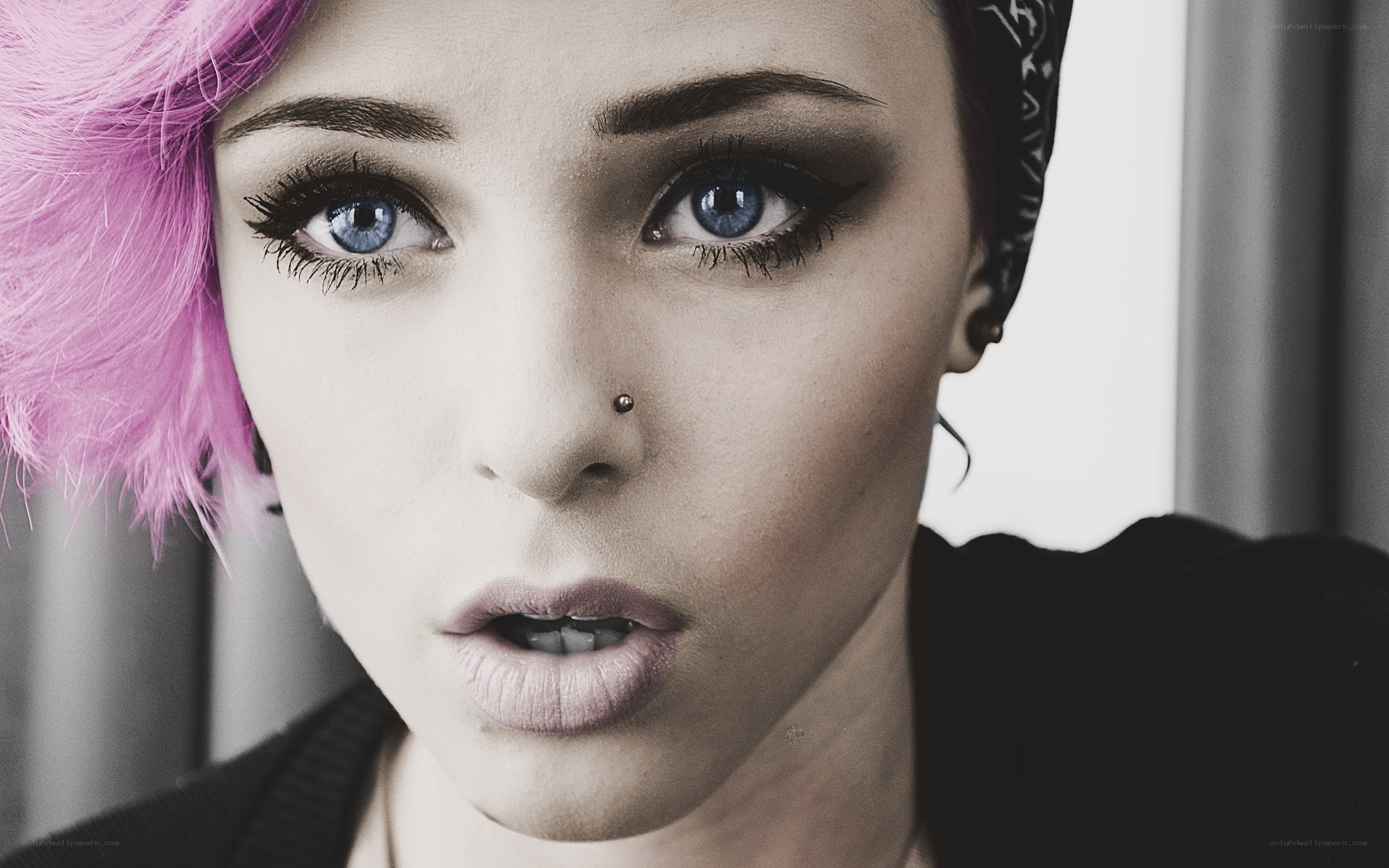 woman with pink hair and blue eyes