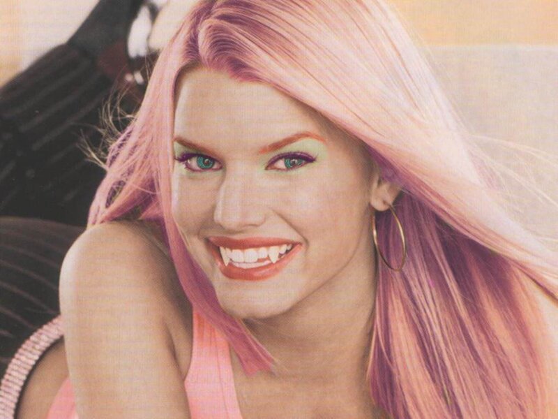 woman with pink hair and fangs
