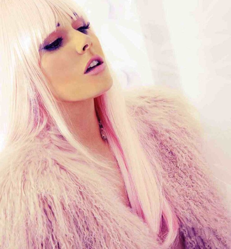 woman with pink hair and fur coat