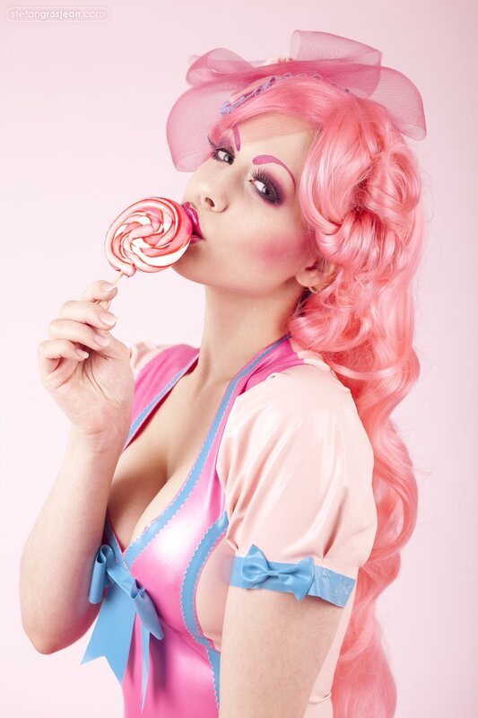 woman with pink hair and lollipop