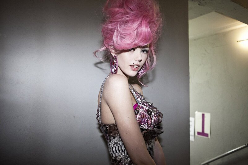 woman with pink hair and sequined dress