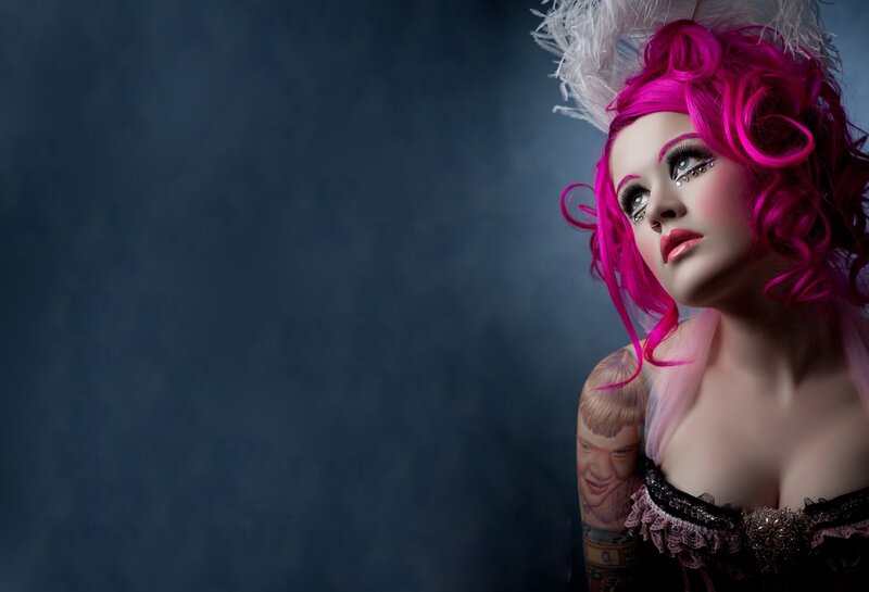 woman with pink hair and tattoo