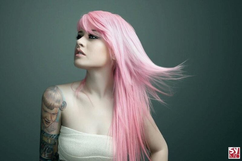 woman with pink hair and tattoo