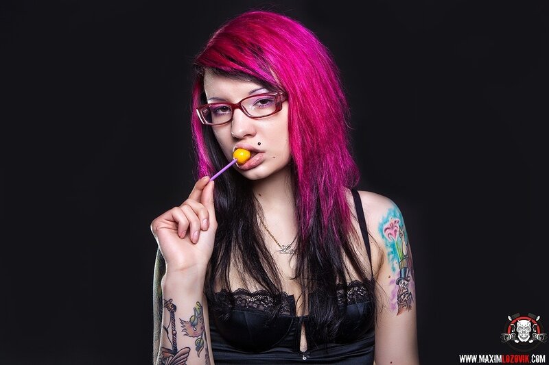 woman with pink hair and tattoos