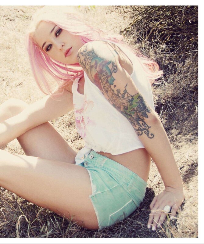 woman with pink hair and tattoos